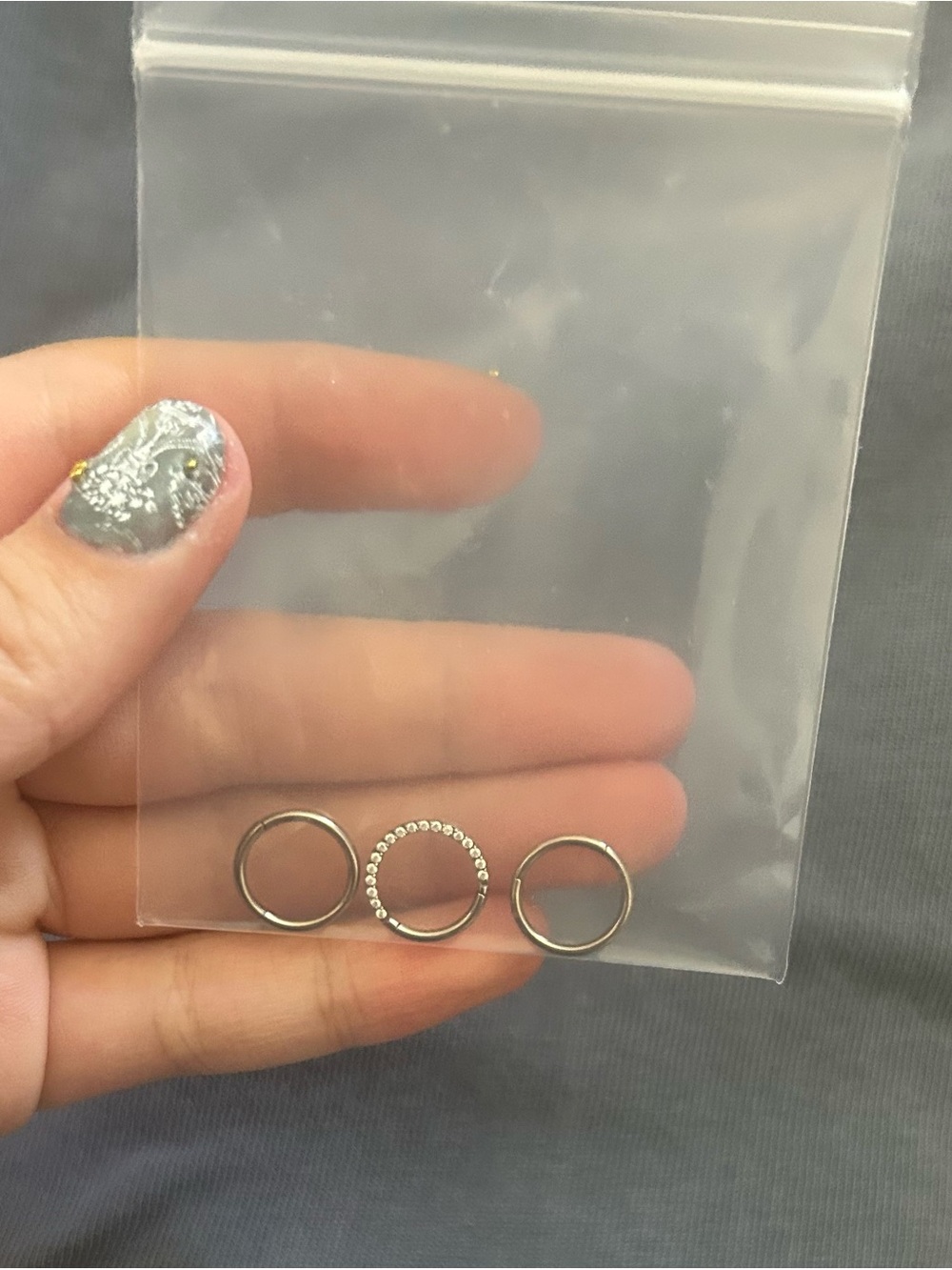 Implant grade titanium clicker rings